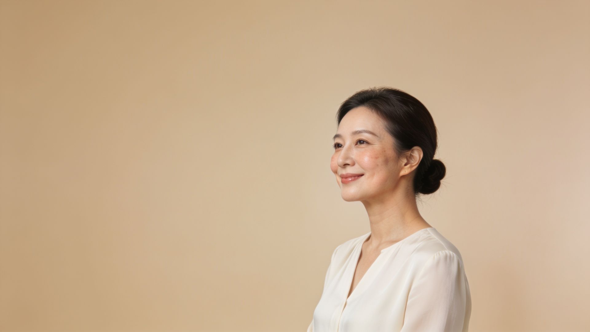 Woman in her early forties with lifted cheeks, illustrating facial muscle and skin treatments