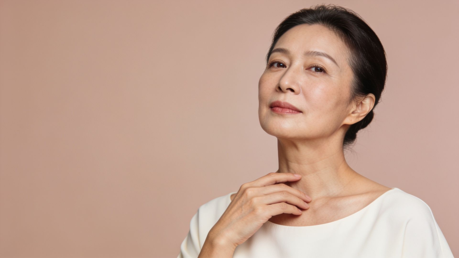 Woman showing the line of her neck, representing neck and hand rejuvenation