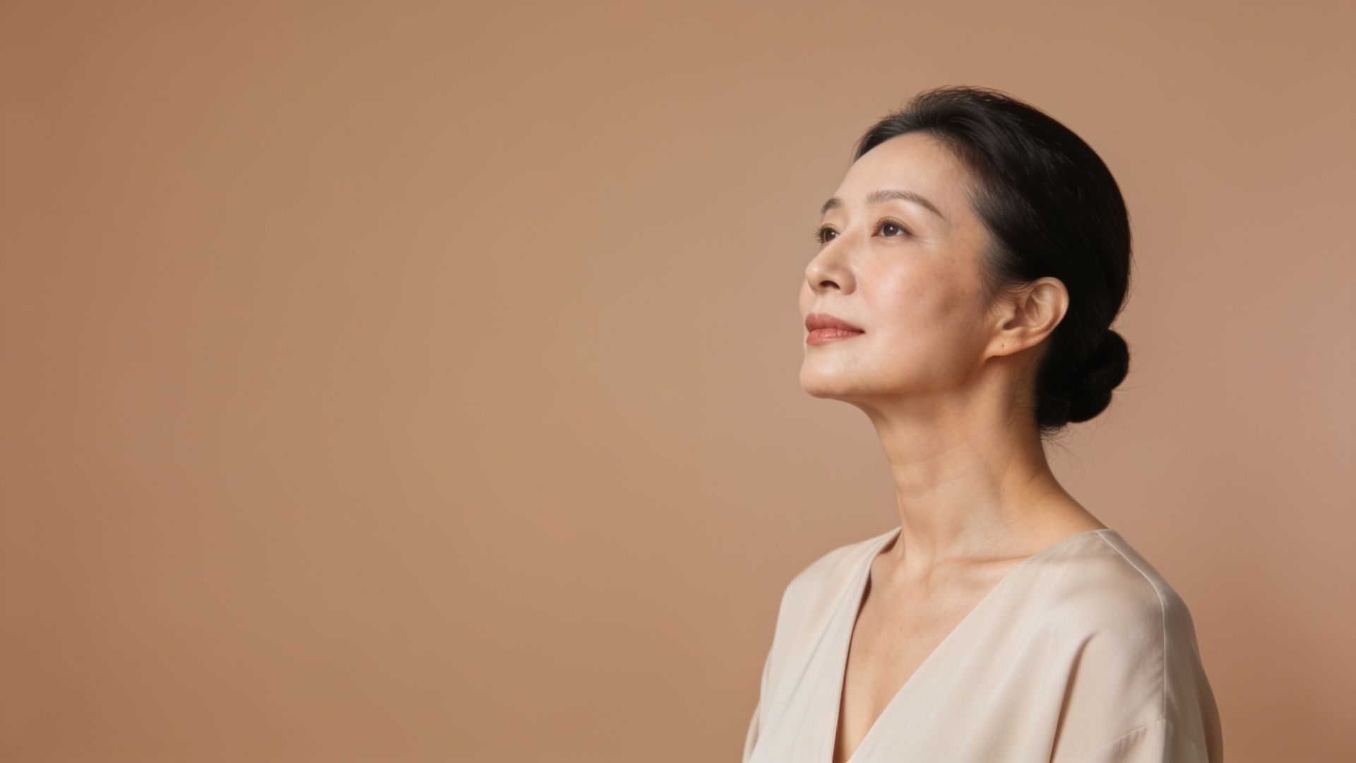 Woman with a smooth neck and jawline, representing neck lines treatment at IN Eternity Clinic, Singapore