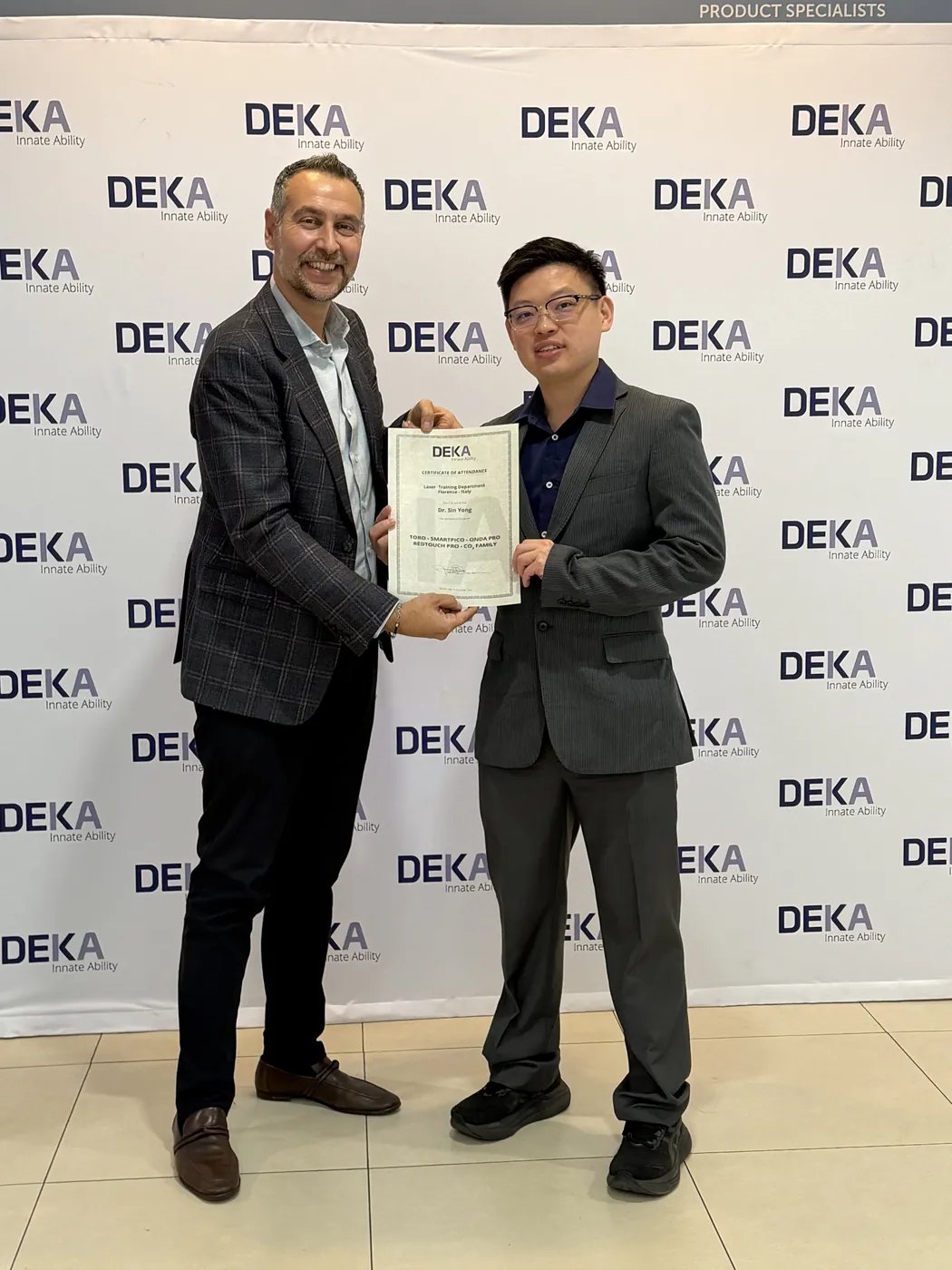 Dr Sin Yong receiving his DEKA Academy certificate of attendance at DEKA in Calenzano